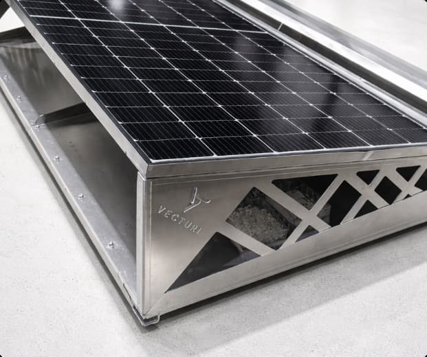 Close-up of a stainless steel solar technology unit with integrated solar panels
