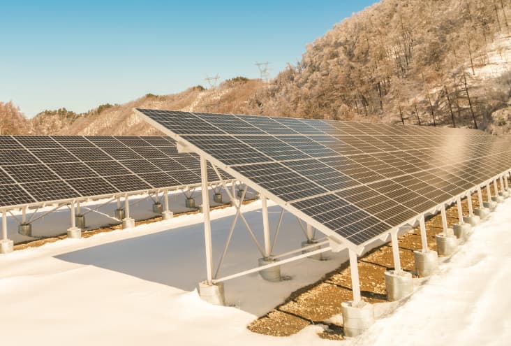 Solar panels surrounded by mountains