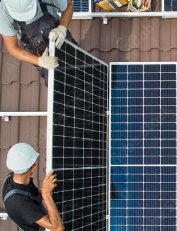 top down view of 2 engineers installing solar panels